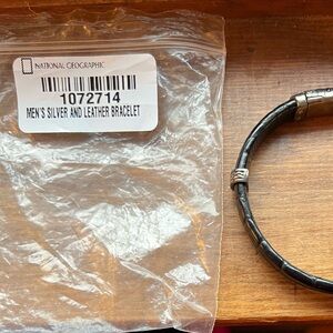 National Geographic black crocodile skin and silver bracelet.